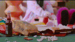 a bag of doritos sits on a messy table