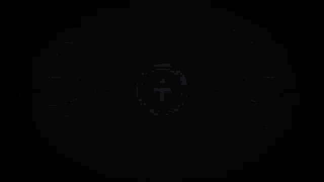 a neon sign that says tbtc network with a t in a circle