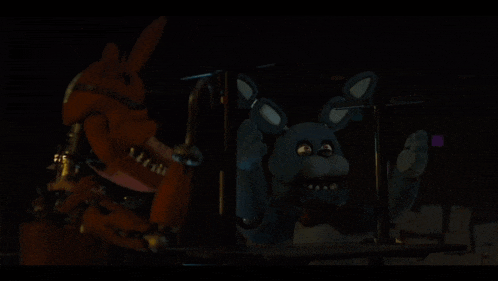 two stuffed animals are standing next to each other and one of them is a bunny