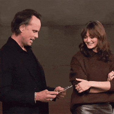 a man and a woman are talking to each other