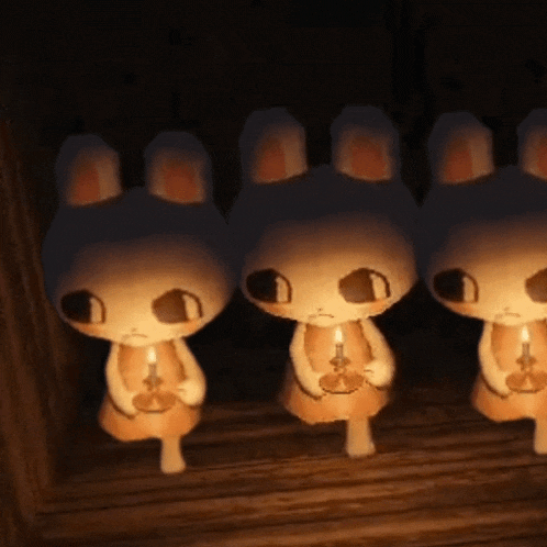 a row of bunny rabbits holding candles in their hands