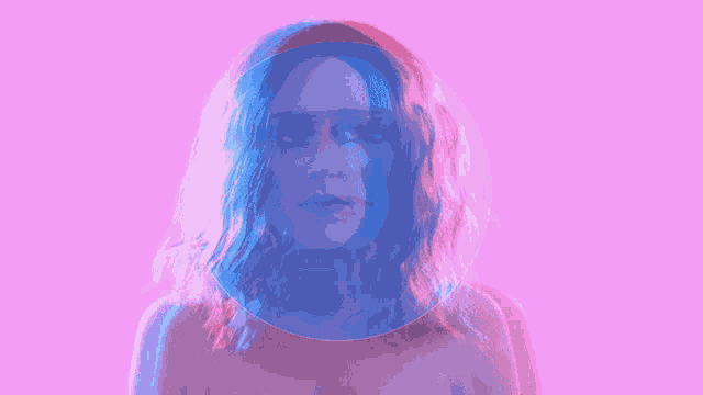 a double exposure of a man and a woman 's faces on a pink background