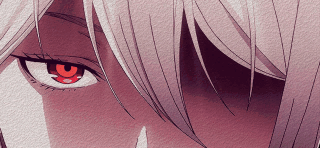 a close up of a person 's eye with red eyes