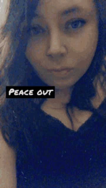 a woman with her eyes closed has a peace out sign above her