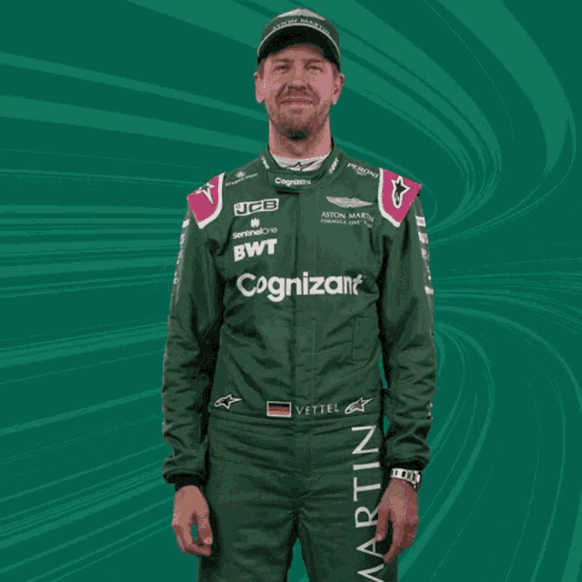a man wearing a green aston martin uniform