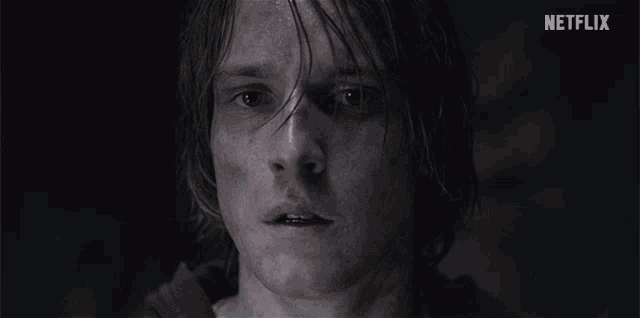 a close up of a man 's face with netflix written in the corner