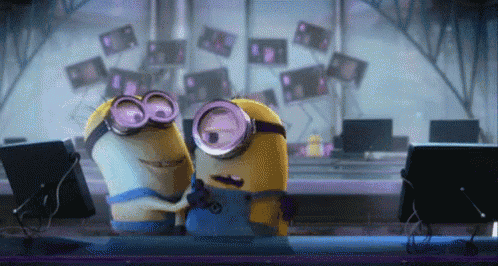 a couple of minions standing next to each other with one wearing a shirt that has the letter o on it