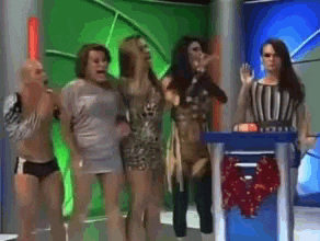 a group of people are standing in front of a podium with a wreath on it
