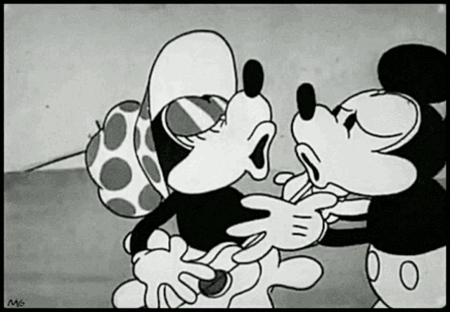 a black and white cartoon of mickey and minnie kissing