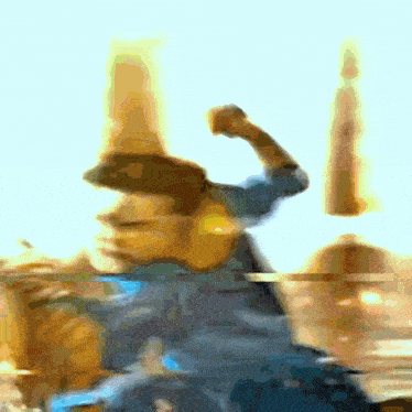 a blurry picture of a person with a cowboy hat on their head