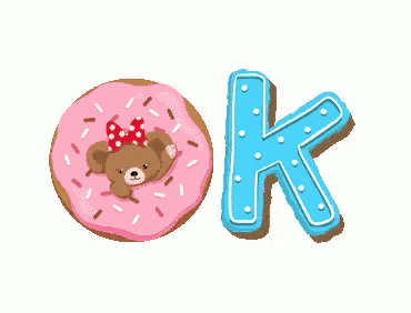 a donut with a teddy bear on it and the word ok