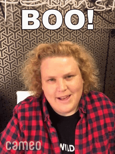 a man in a plaid shirt with the words boo written on it