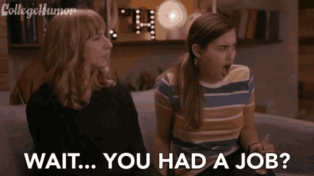 two women are sitting on a couch and one of them says wait you had a job