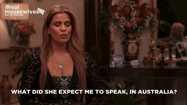 a woman in a black dress says what did she expect me to speak