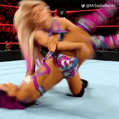 a woman is wrestling another woman in a wrestling ring with the words mrs sasha banks on the bottom
