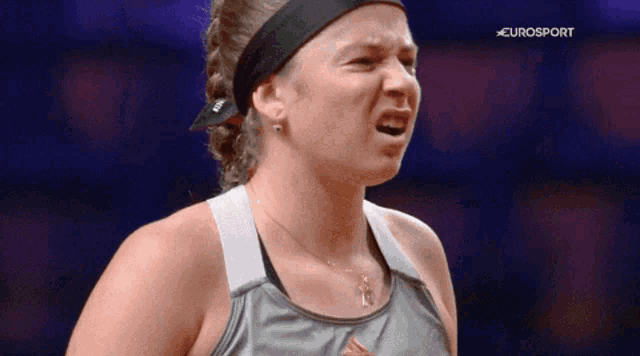 a close up of a woman 's face with eurosport in the background