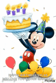 mickey mouse is holding a birthday cake and balloons in his hand .