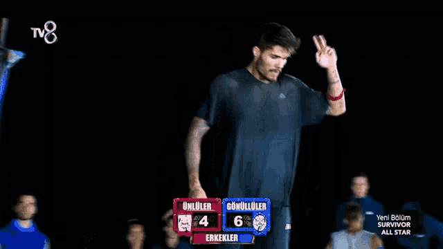 a man is standing in front of a scoreboard that says survivor all star