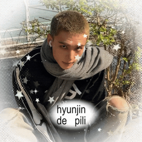 a man with a scarf around his neck has the name hyunjin de pili on the bottom