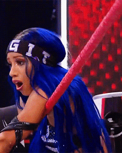 a woman with blue hair is wearing a headband that says g1