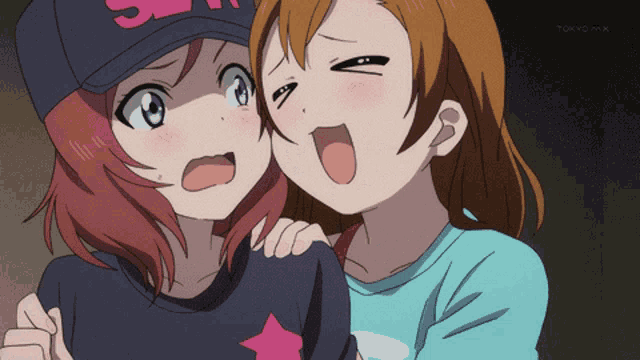 two anime girls are standing next to each other with tokyo mx in the bottom right corner