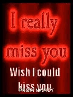 a red sign that says `` i really miss you wish i could kiss you '' .