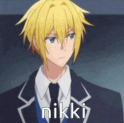 a man in a suit and tie with the word nikki written on his face