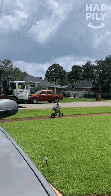 a picture of a child riding a bike with the words hap pily in the corner