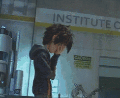 a person standing in front of a sign that says institute