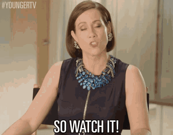 a woman is sitting in a chair with her eyes closed and says " so watch it "