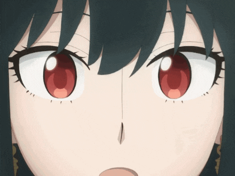 a close up of a girl 's eyes with red and white irises
