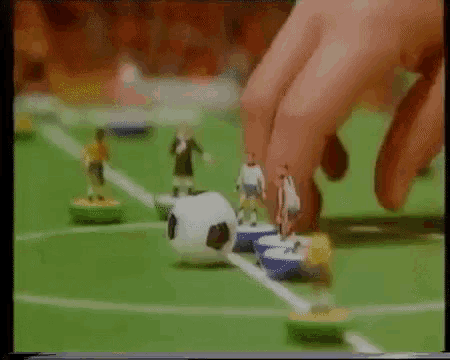 a person is playing a game of soccer with their fingers .