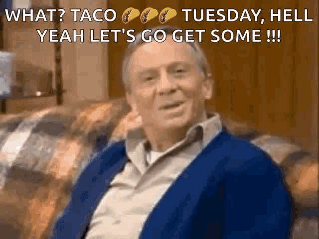 a man in a blue sweater is sitting on a couch with the words what taco tuesday hell