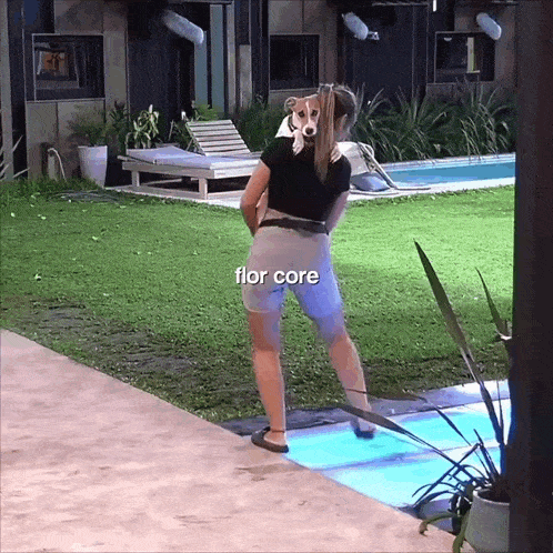 a woman standing in front of a swimming pool with the word flor core written on the bottom