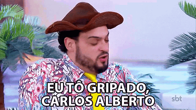 a man wearing a cowboy hat says " eu to gripado "