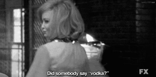 a black and white photo of a woman saying " did somebody say " vodka