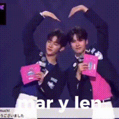 two men are making a heart shape with their hands and the words mar y len are on the bottom