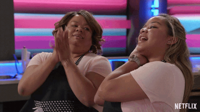 two women are clapping in a netflix advertisement