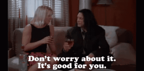 a man and a woman are sitting on a couch and the man says do n't worry