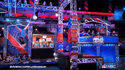 a ninja warrior show is being filmed in a stadium