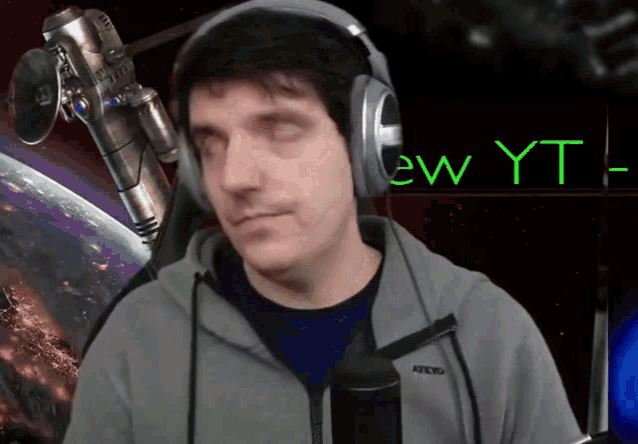 a man wearing headphones with the word ew yt on the bottom right