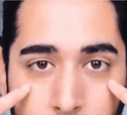 a close up of a man 's eyes and nose