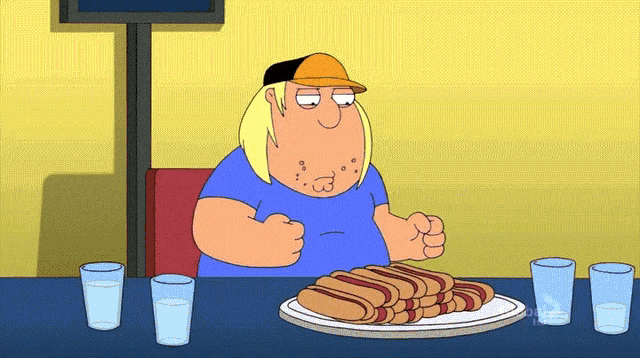 a cartoon character is sitting at a table eating hot dogs