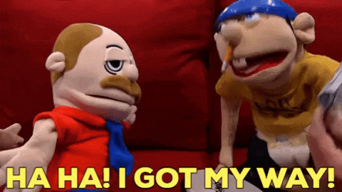 two stuffed animals are sitting next to each other on a red couch and one of them says ha ha ! i got my way