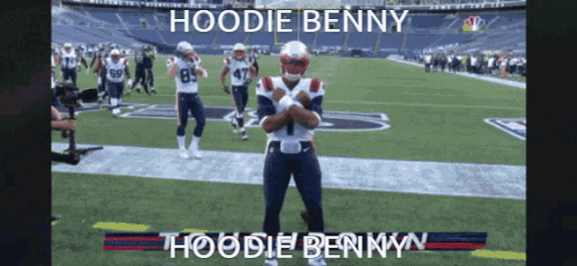 a football player named hoodie benny stands on a field
