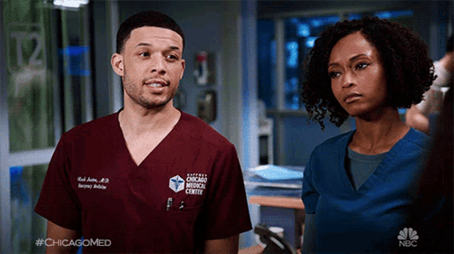 a man and a woman standing next to each other in a chicago medical center