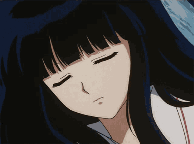 a close up of a cartoon character with her eyes closed