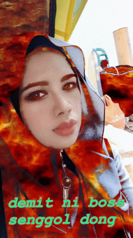 a woman wearing a hijab with the words demit ni boss senggol dong written below her