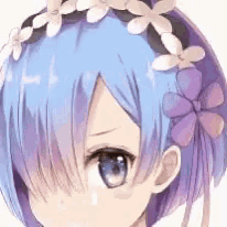 a close up of a girl with blue hair and a flower crown in her hair .