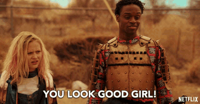 a man and a girl are standing next to each other and the girl is saying you look good girl
